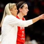 Christie Sides coaching courtside during a WNBA game